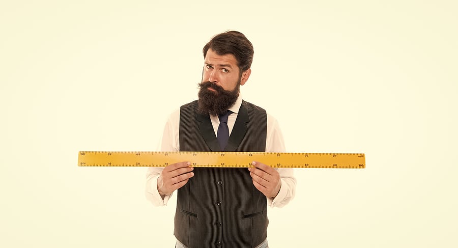 Man holding a ruler