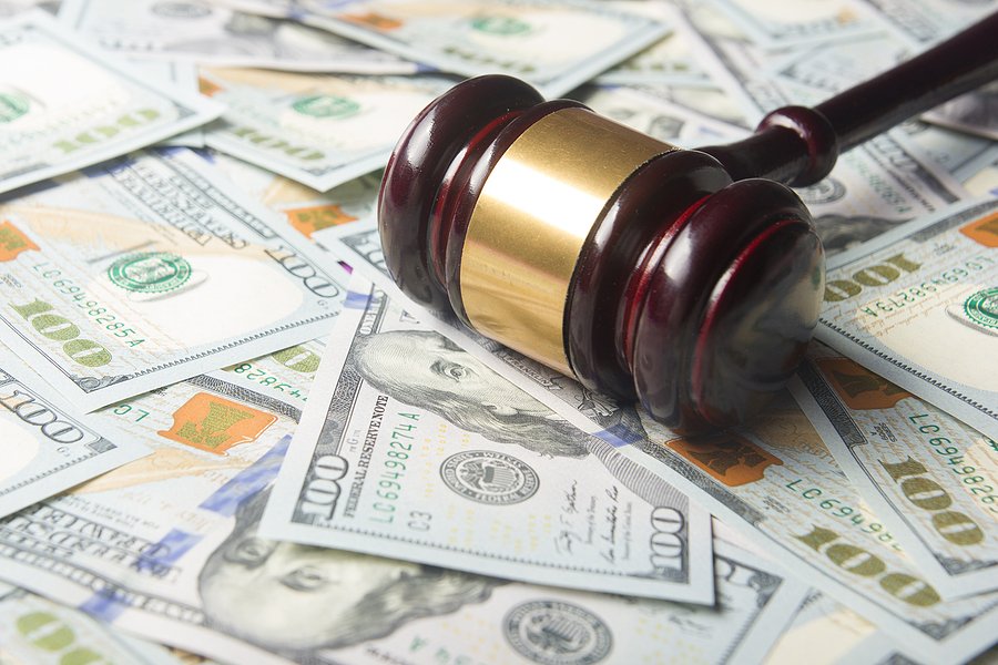 Gavel with money behind it
