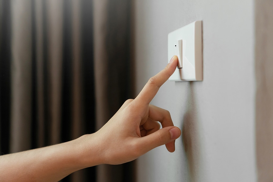 Person touching a light switch
