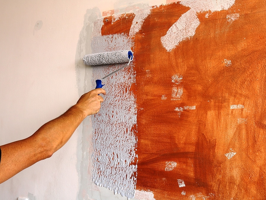 Paint roller being used to repaint
