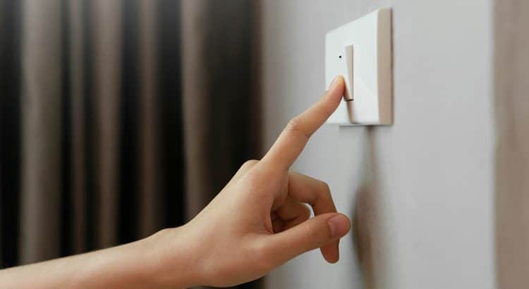 Person touching a light switch